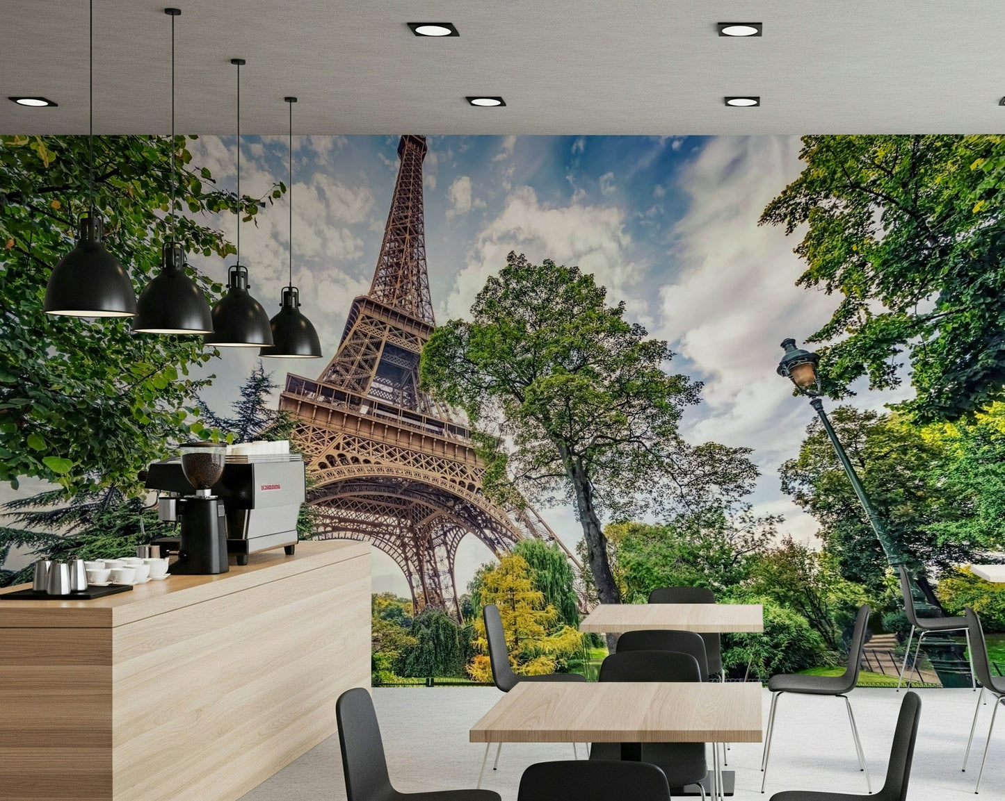 Eiffel Tower Greens wallpaper mural of the Eiffel Tower behind a cafe counter with espresso machine and tables