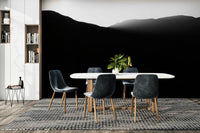 The wallpaper is used as a feature wall in a bedroom.

