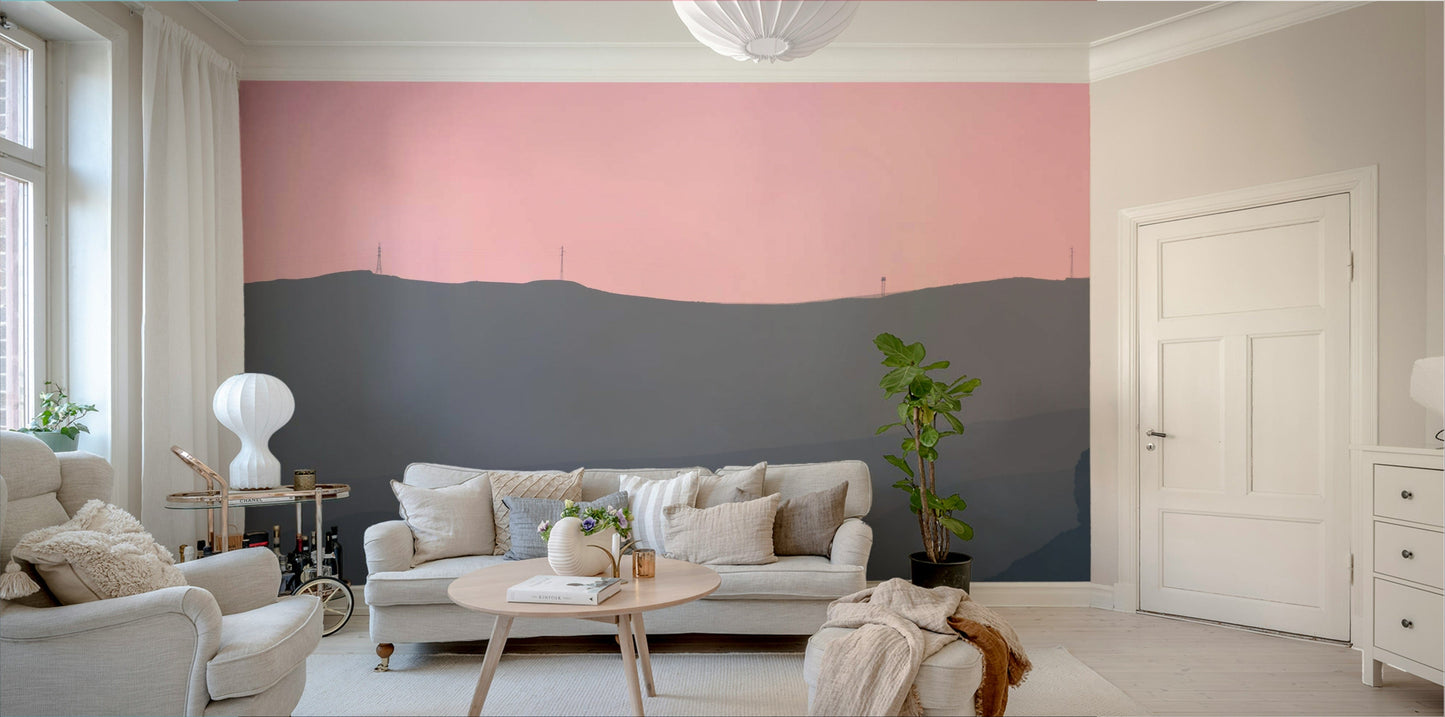 A living room with the mountain landscape wall mural.

