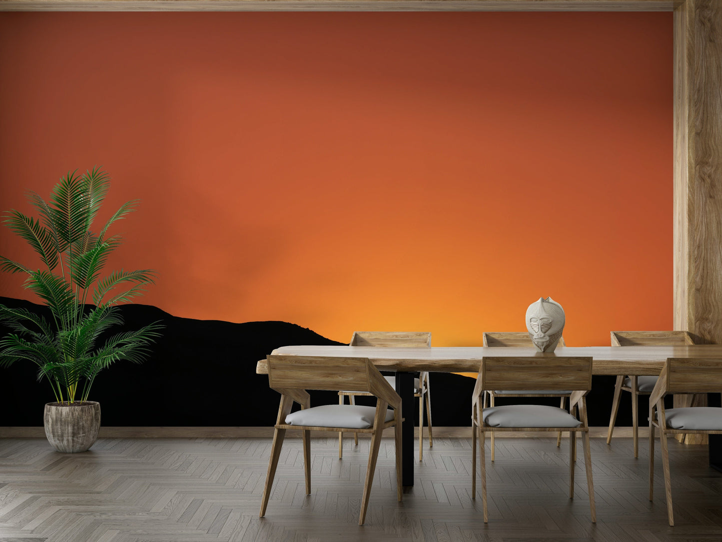 A beautiful, layered mountain landscape with a vibrant sunset sky.

