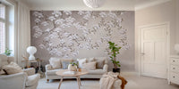 Floral Branches Mountain wallpaper mural with white magnolia branches behind a cream sofa in a bright living room