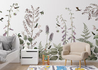 Hummingbird Hedge wallpaper mural with ferns and hummingbirds above a white toddler bed and beige armchair
