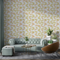 Elegant Palm Leaves wallpaper in a living room with a sage green chesterfield sofa and tan accent chair