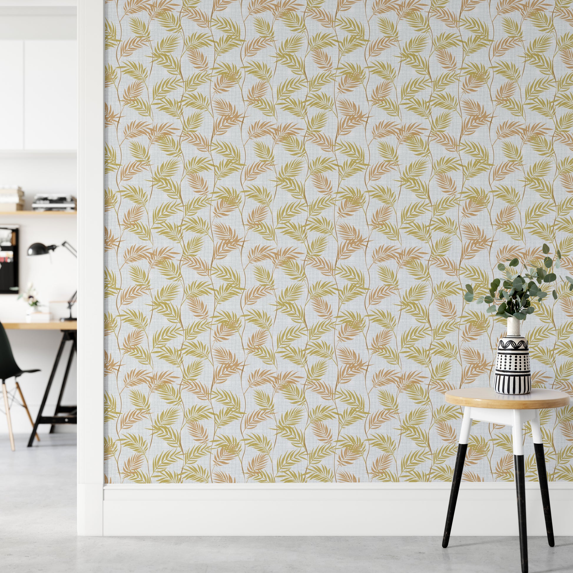 Elegant Palm Leaves wallpaper in a home office with a white desk and a round table holding eucalyptus