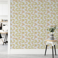 Elegant Palm Leaves wallpaper in a home office with a white desk and a round table holding eucalyptus