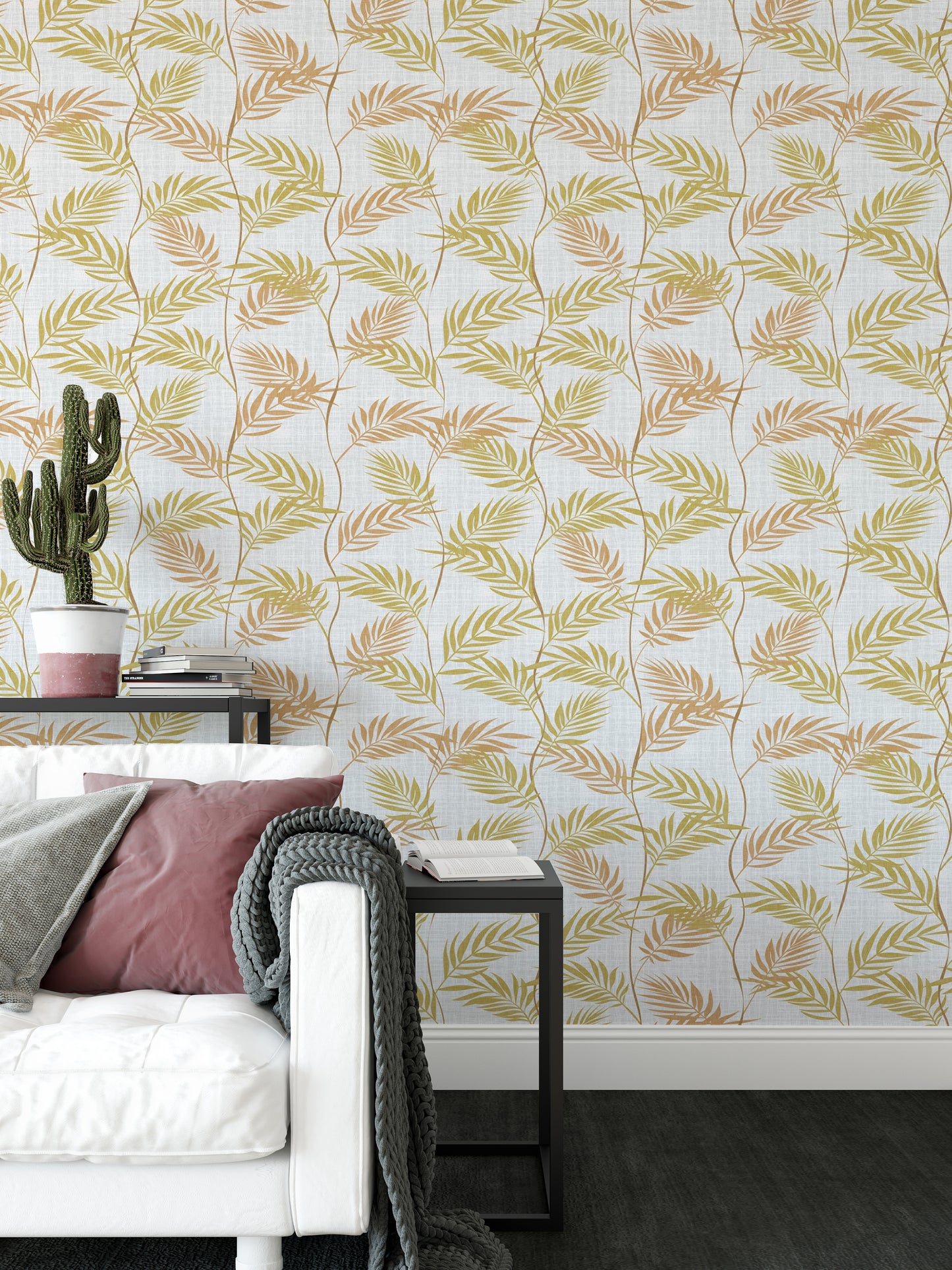 Elegant Palm Leaves wallpaper behind a white sofa with a pink cushion and a potted cactus on a side table