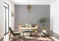 Textured wall mural with smooth stone block patterns creating a refined and modern accent wall.