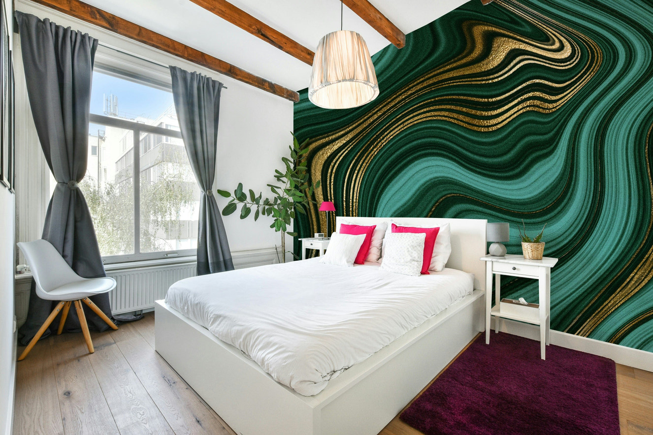 Wall mural with emerald and gold swirls.

