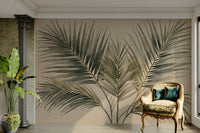 Emerald Palm Fronds wallpaper mural with olive green and teal palm leaves in an elegant living room with an armchair