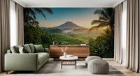 Tropical scenery wall mural with emerald fields and mountain sunrise