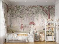 Removable Unicorn Forest Green Wallpaper Mural in a kids room with a grey rug and scattered plush toys.