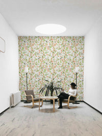 Close-up of chinoiserie design with soft florals and perched birds.

