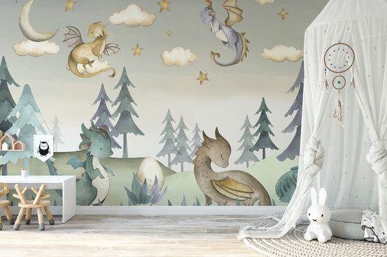 Enchanted Dragon wall mural with pastel watercolor dragons over a pine forest in a nursery with a canopy and bunny toy