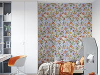 Hand-drawn bird and floral mural on a light neutral background.

