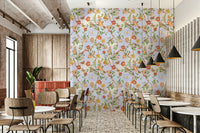 Enchanted garden design with birds resting on flowering branches.


