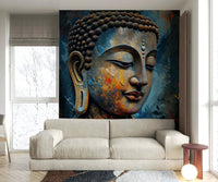 Enlightenment wallpaper mural of a textured Buddha face behind a beige sofa and globe floor lamp in a living room