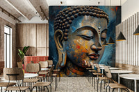 Enlightenment wallpaper mural of a textured Buddha face above wood chairs and tables in a cafe dining space