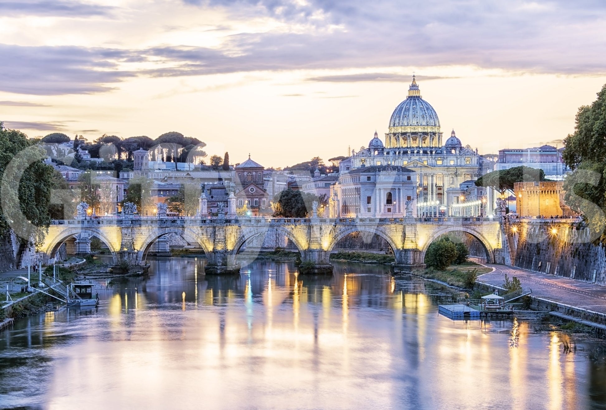 Eternal City Lights wallpaper mural shown as a close-up of St Peter's Basilica and the lit Tiber bridge at dusk