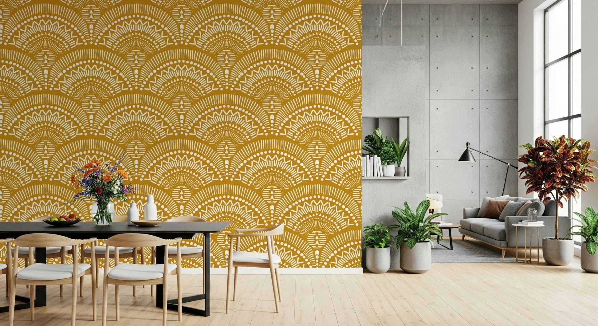 Ethnic Echoes wallpaper in mustard yellow behind a black dining table and chairs with potted plants