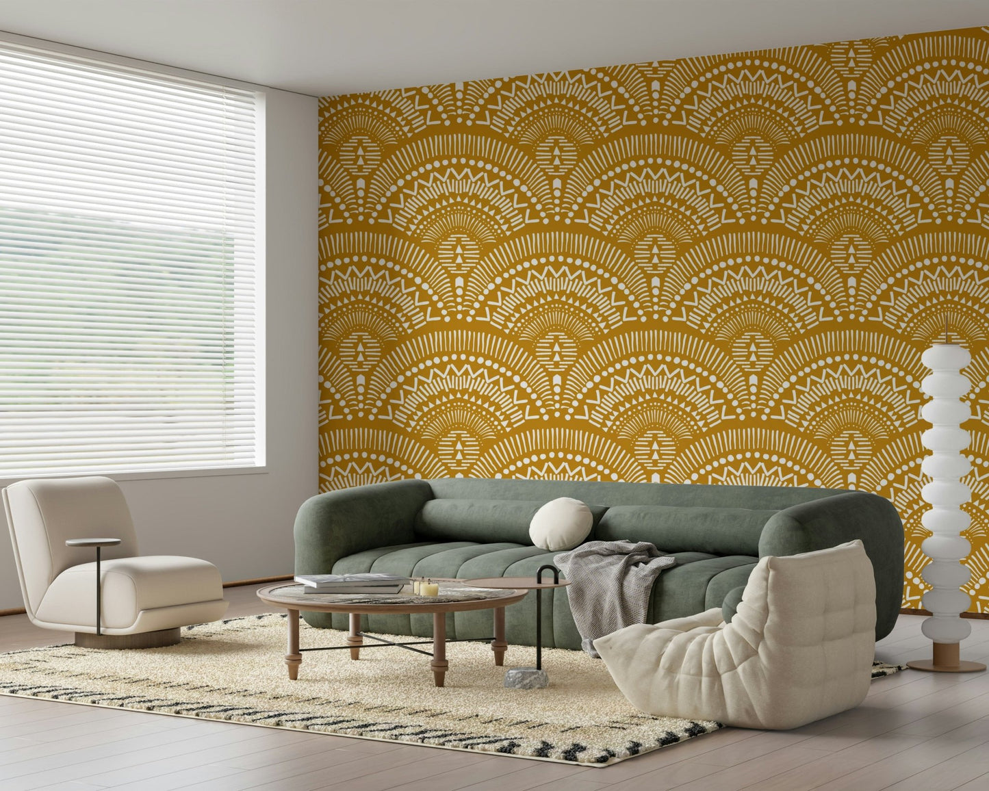 Ethnic Echoes wallpaper in mustard and white behind a sage green sofa and cream chair in a living room
