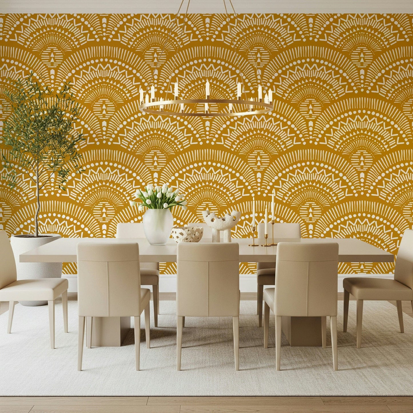 Ethnic Echoes wallpaper in mustard yellow behind a white dining table and chairs under a chandelier