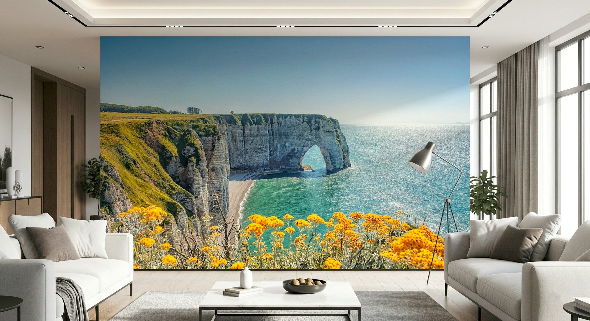 Coastal cliff wall mural with yellow flowers, natural green color palette and ocean wallpaper style
