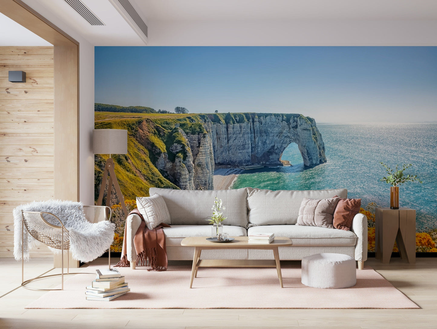 Etretat cliff arches wall mural with yellow blooms, green color shades and sea wallpaper waterline