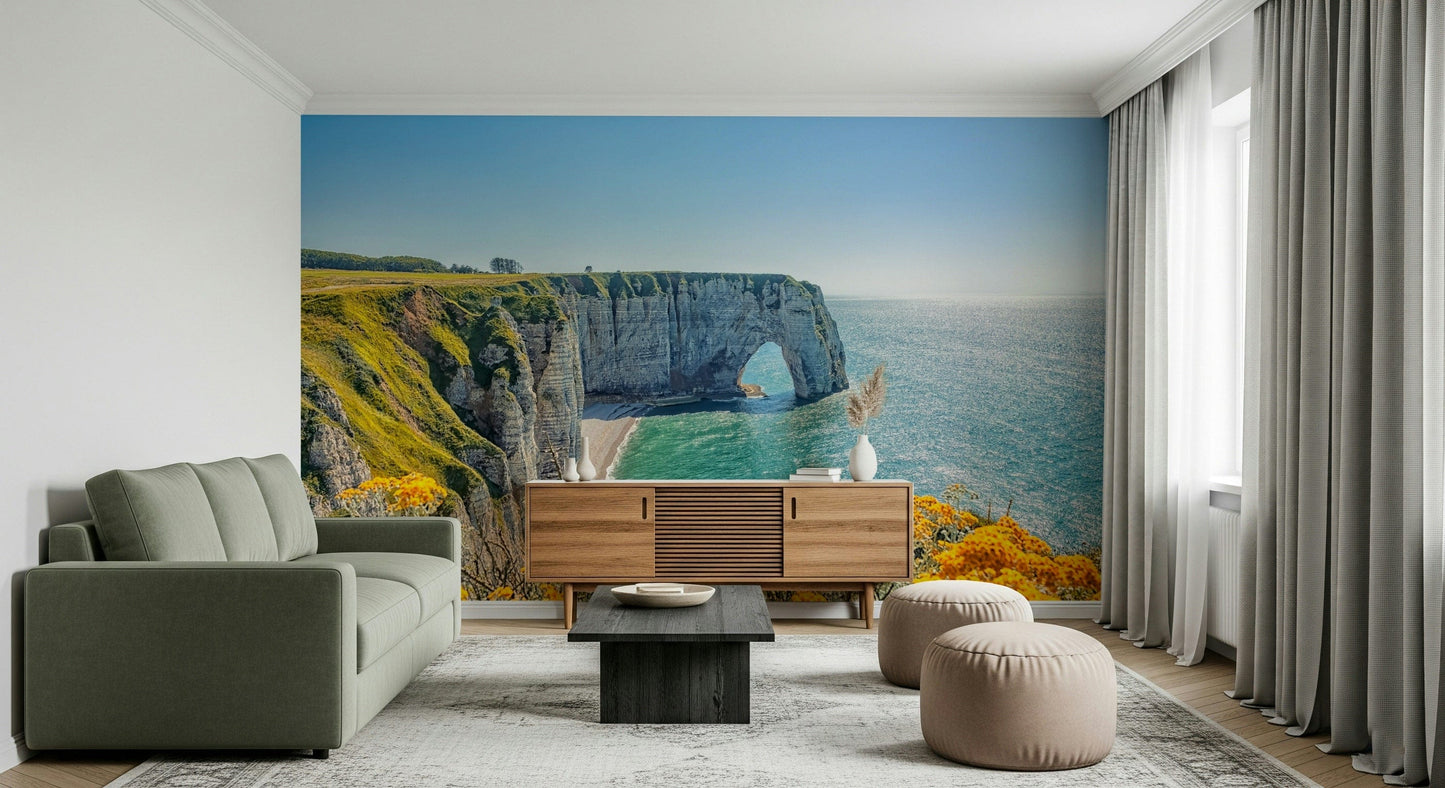 Yellow bloom wall mural on rocky coast, balanced green color details and ocean wallpaper backdrop