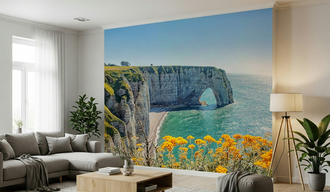 Etretat coastline wall mural featuring yellow blooms, soft green color and sea wallpaper background