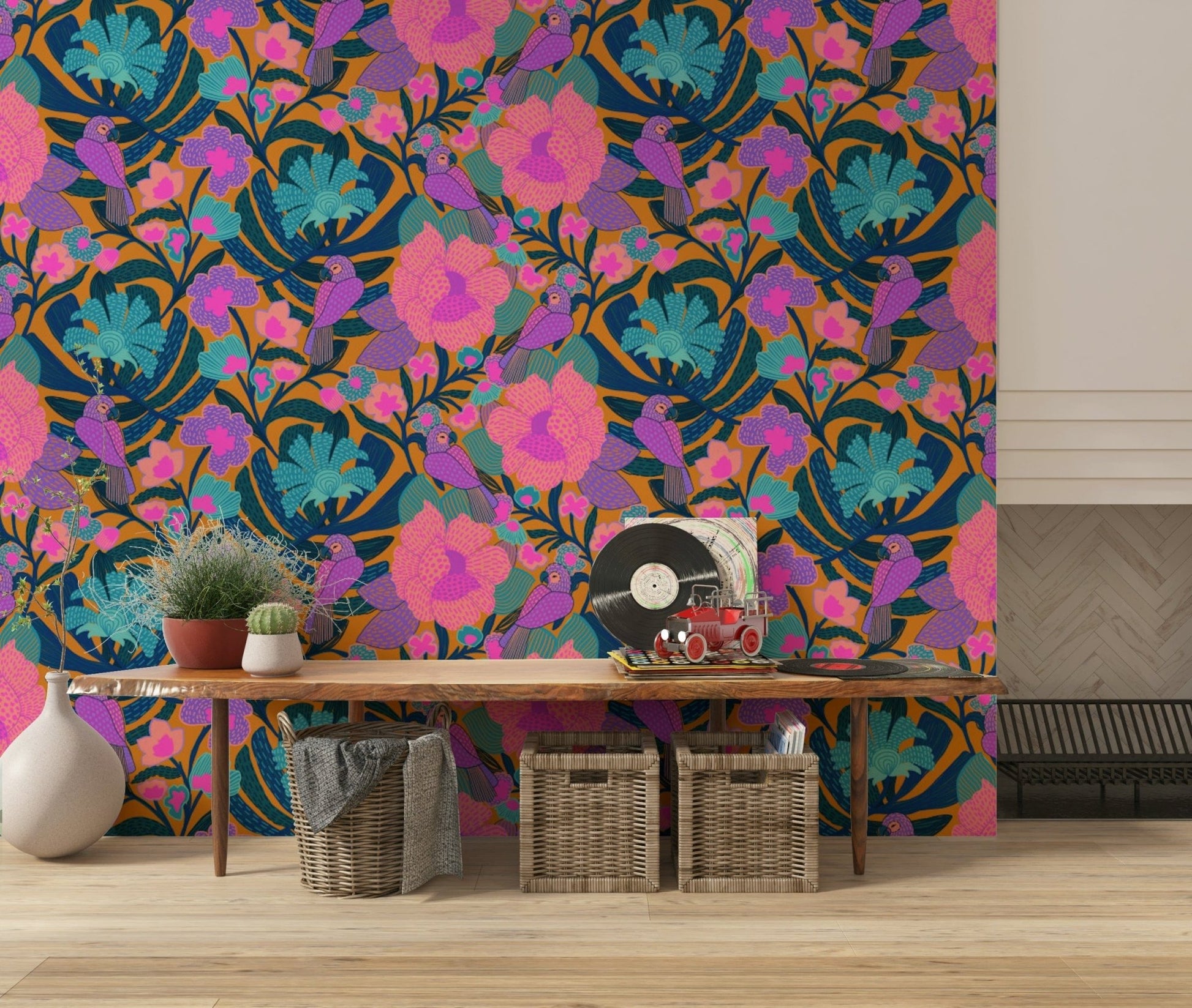 Exotic Bloom wallpaper of parrots and flowers above a wood console bench with woven baskets in an entryway