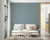 Wall mural with aged ogee pattern in soft hues

