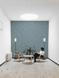 Calm interior with faded damask blue wallpaper

