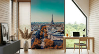 Fall in Paris wallpaper mural with Eiffel Tower behind a wood desk and laptop in a home office
