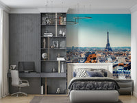 Fall in Paris wallpaper mural with Eiffel Tower above a zebra-print bed in a grey bedroom with a desk