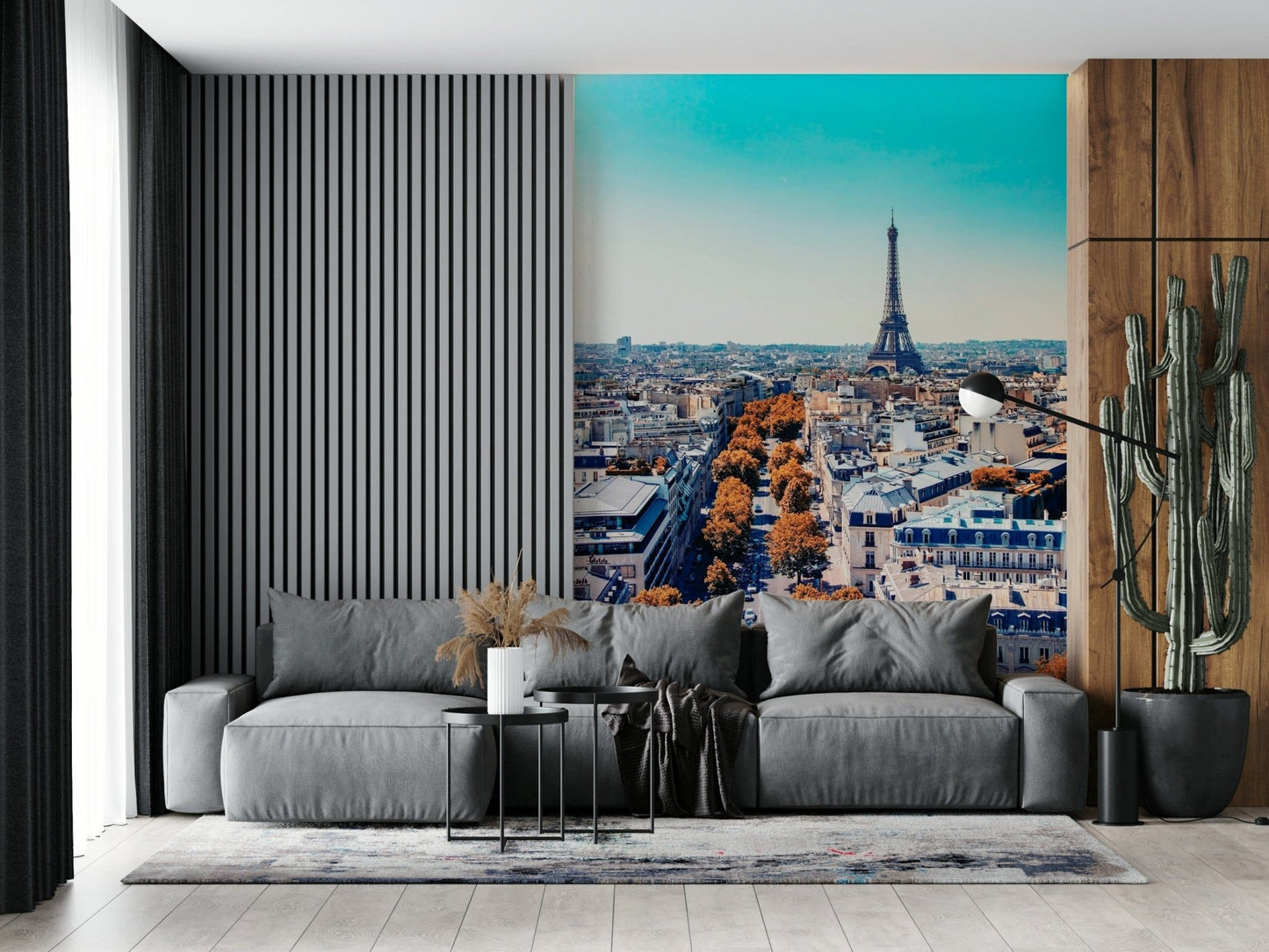 Fall in Paris wallpaper mural of the autumn skyline behind a grey sofa beside a slatted wood wall