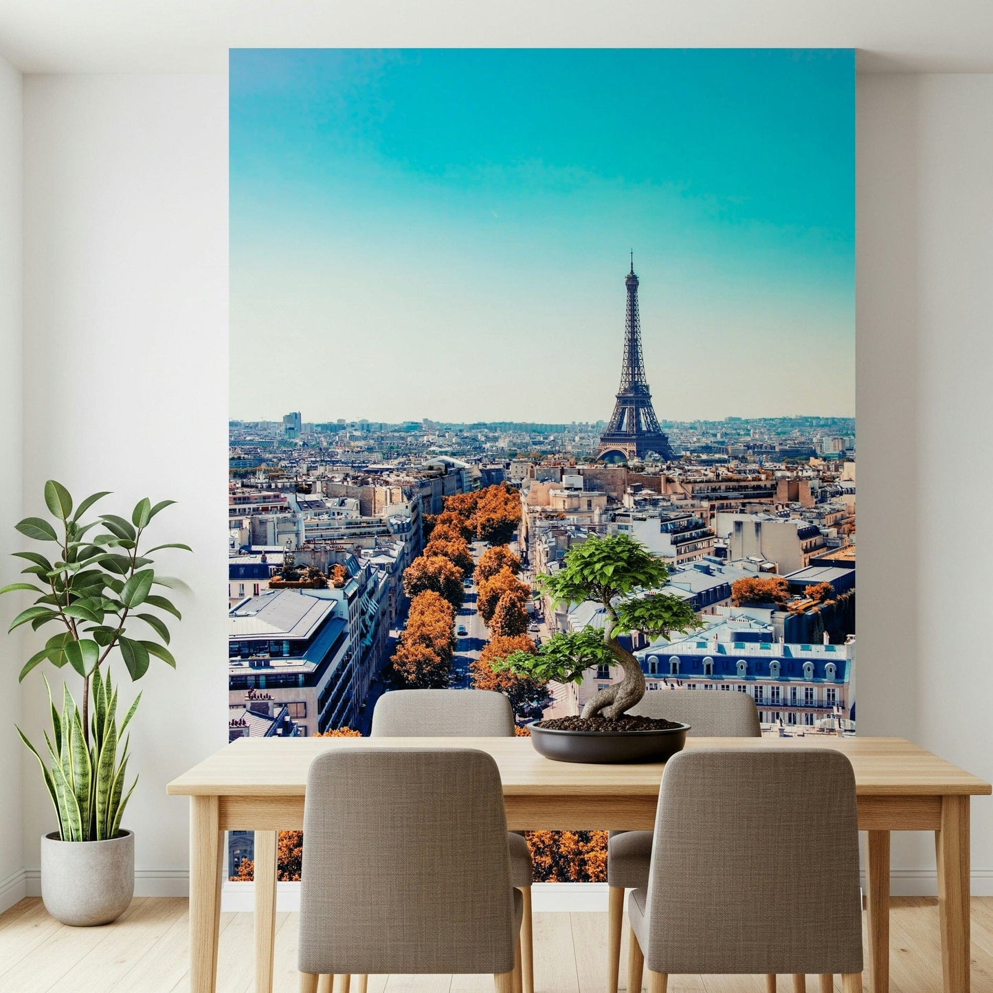 Fall in Paris wallpaper mural with Eiffel Tower and orange trees behind a light wood dining table and bonsai