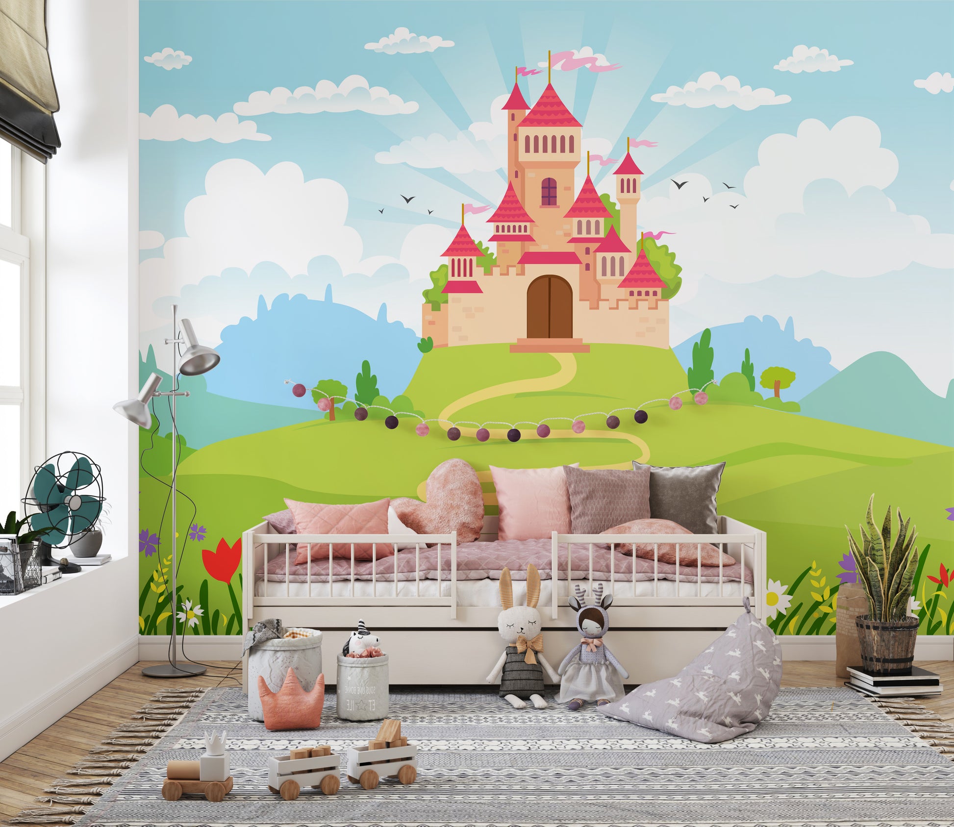 Fantacy Castle wallpaper of a pink hilltop castle behind a cream daybed with pink pillows and plush toys in a girls room