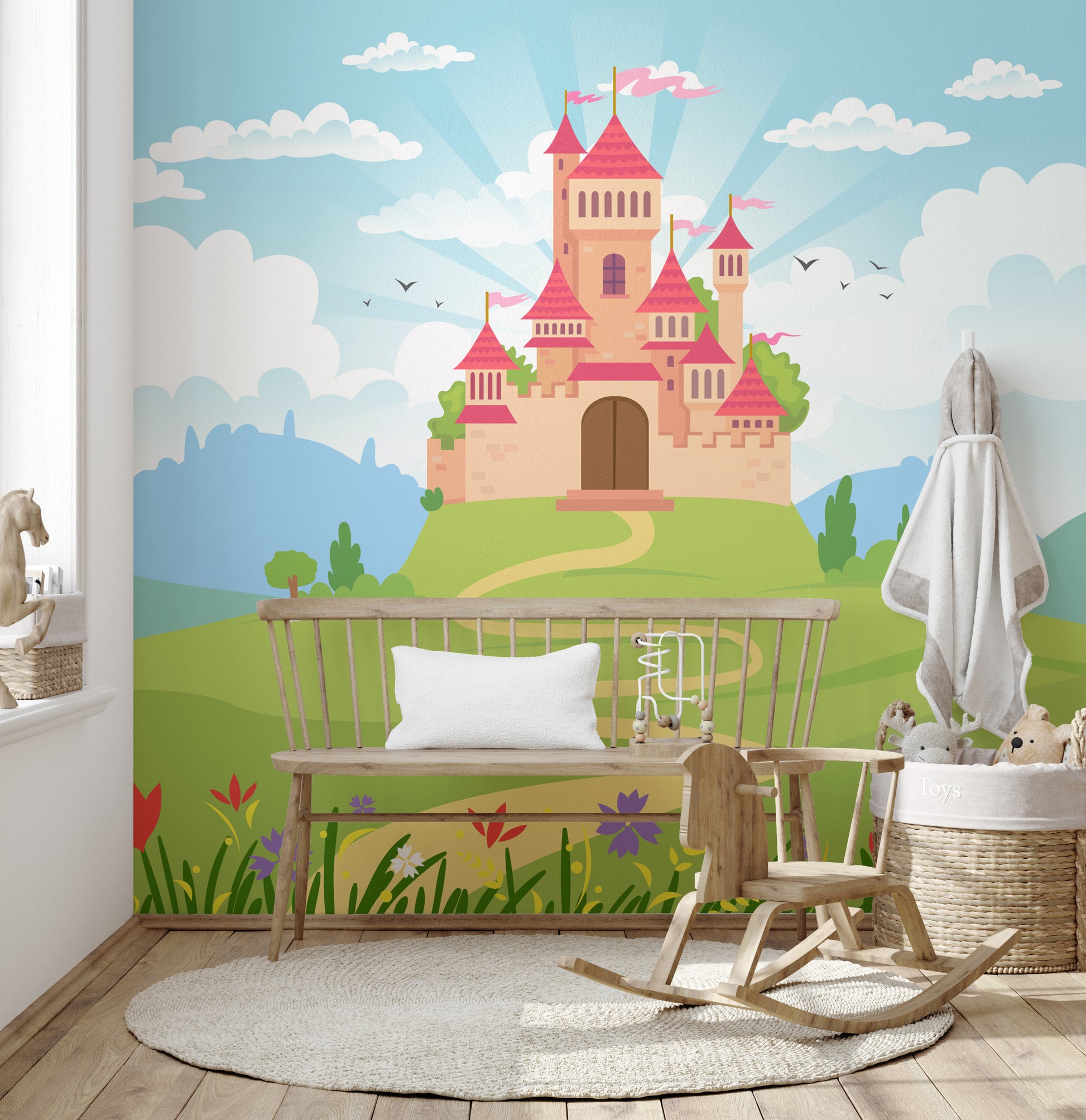 Fantacy Castle wallpaper showing a pink castle and blue sky in a kids room with a wood bench, rocking horse and toy basket