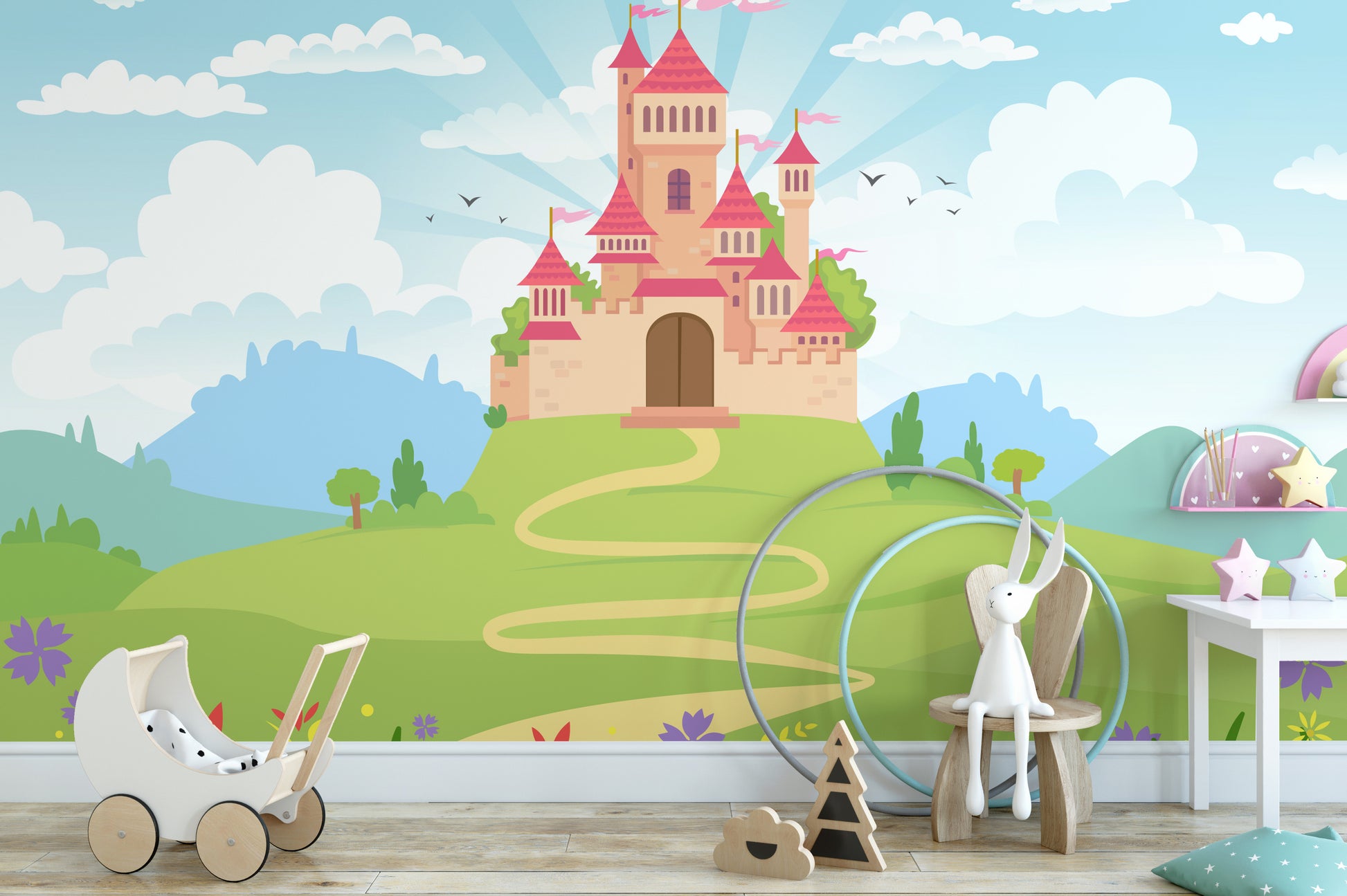 Fantacy Castle wallpaper with a pink fairytale castle on a green hill in a girls room with a toy pram and bunny on a wooden chair