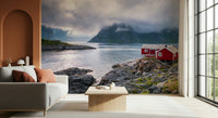 Nordic landscape mural with a vibrant red cabin beside a reflective fjord framed by towering mountains.