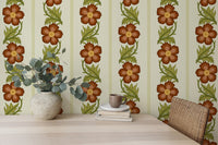 Floral Stripe Red wallpaper, rust flowers and leaves behind a desk with eucalyptus in a home office