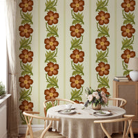 Floral Stripe Red wallpaper, vertical rust floral stripes behind a round dining table and wishbone chairs