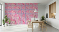 Pretty pink floral tile pattern wallpaper in a guest bathroom with gold fixtures.