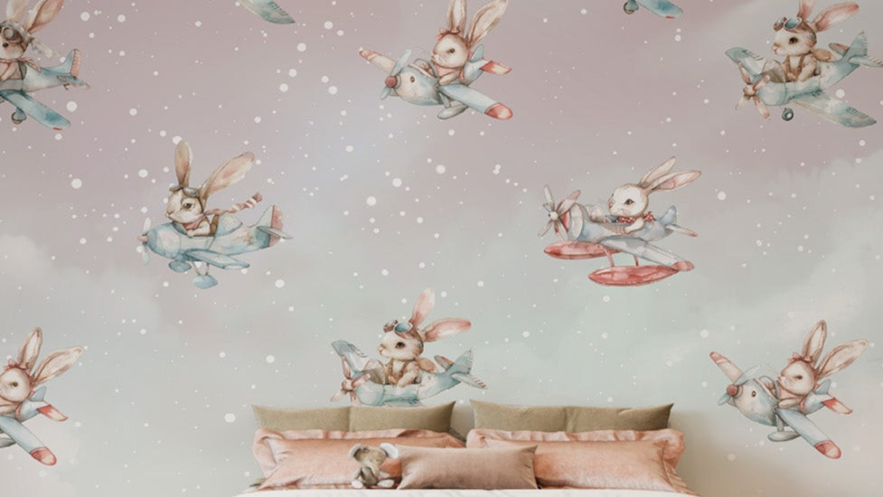 Playful bunnies flying airplanes in the sky-themed wallpaper.