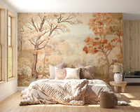 Forest Autumn Watercolor Beige wallpaper of beige and orange trees behind a chunky knit cream bed by a window