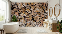 Fractured Timber wallpaper mural of cut logs behind a white freestanding tub and wood vanity in a bathroom