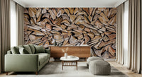 Fractured Timber wallpaper mural of split firewood behind a sage green sofa and wood sideboard