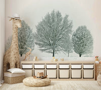 Snow-covered trees and soft landscape mural for a calming atmosphere.

