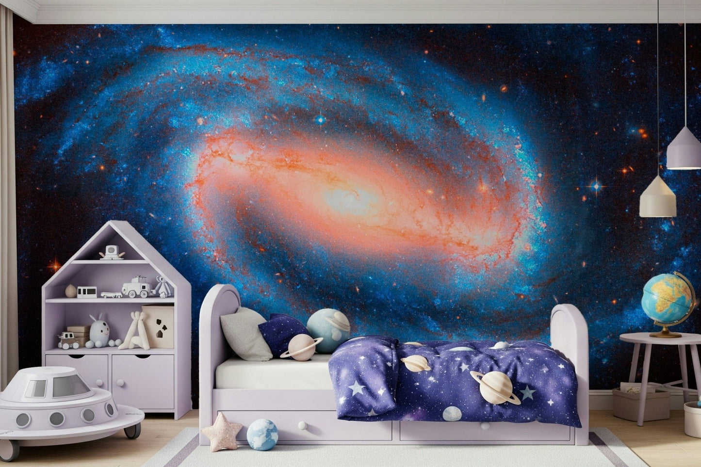Galaxy Dream wallpaper mural of a blue spiral galaxy with a glowing core in a kids room with a lilac bed