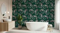 Gecko Groove wallpaper in dark green with white geckos behind a freestanding tub in a modern bathroom